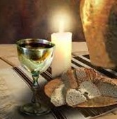 image of bread wine candle and flagon